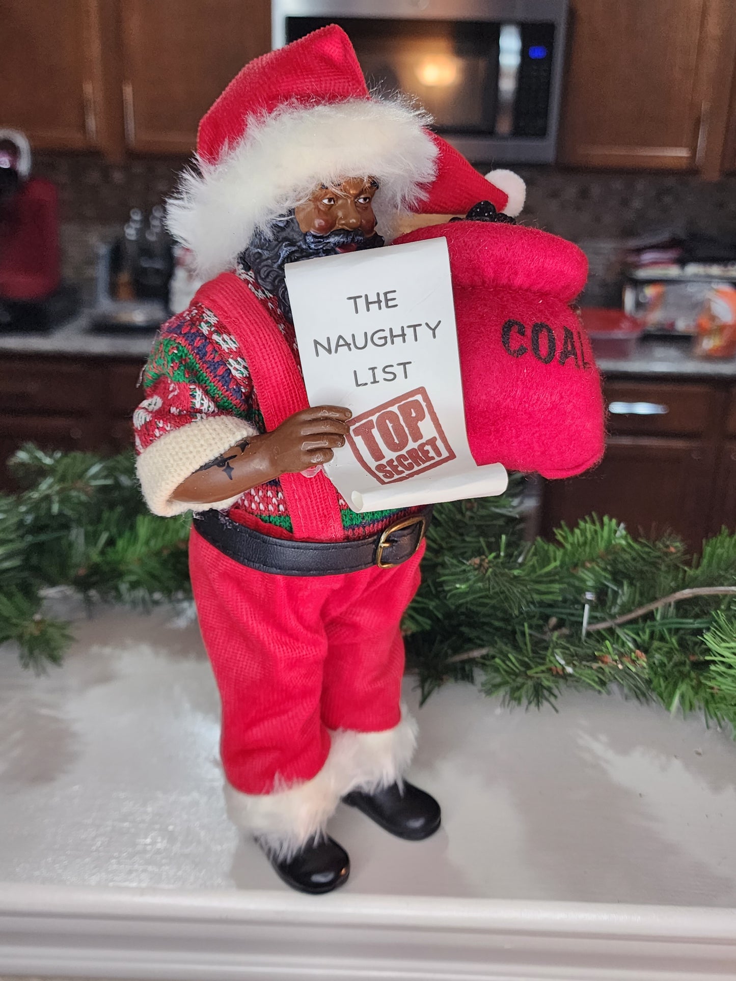 Santa with the Naughty List and Bag of Coal